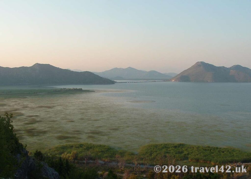 Lake Skadar stretching towards the mountains of Montenegro