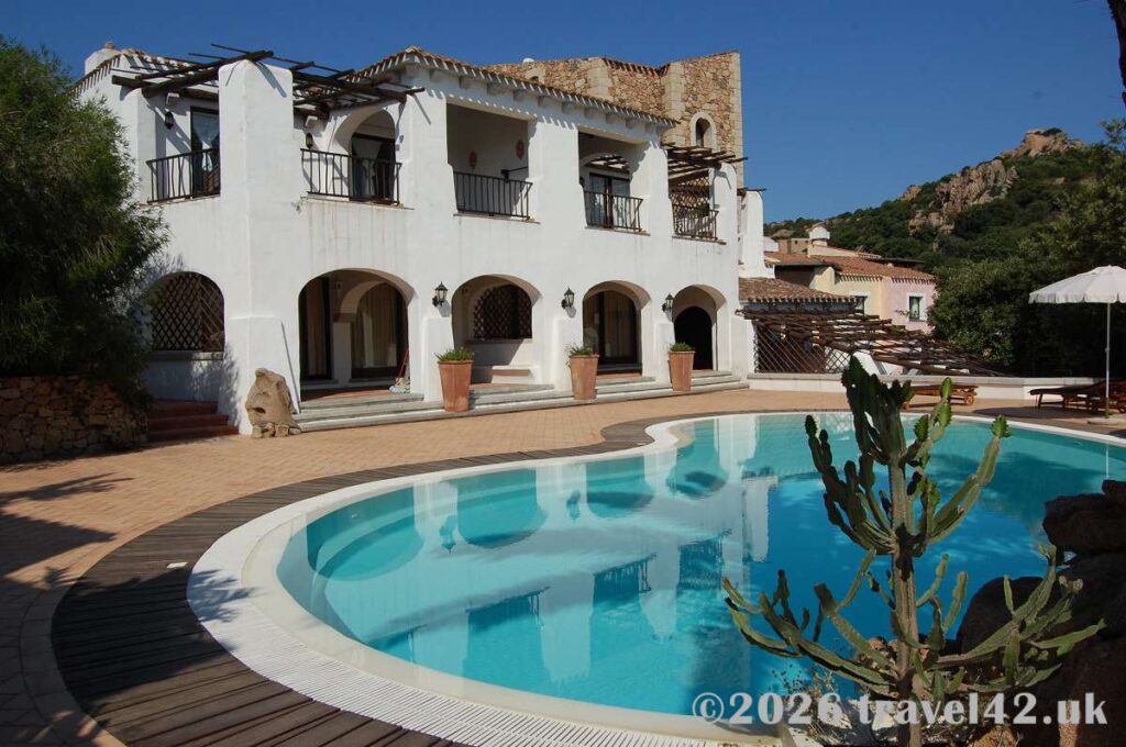 A traditional Costa Smeralda resort villa, with whitewashed arches, terracotta roofs and a private pool