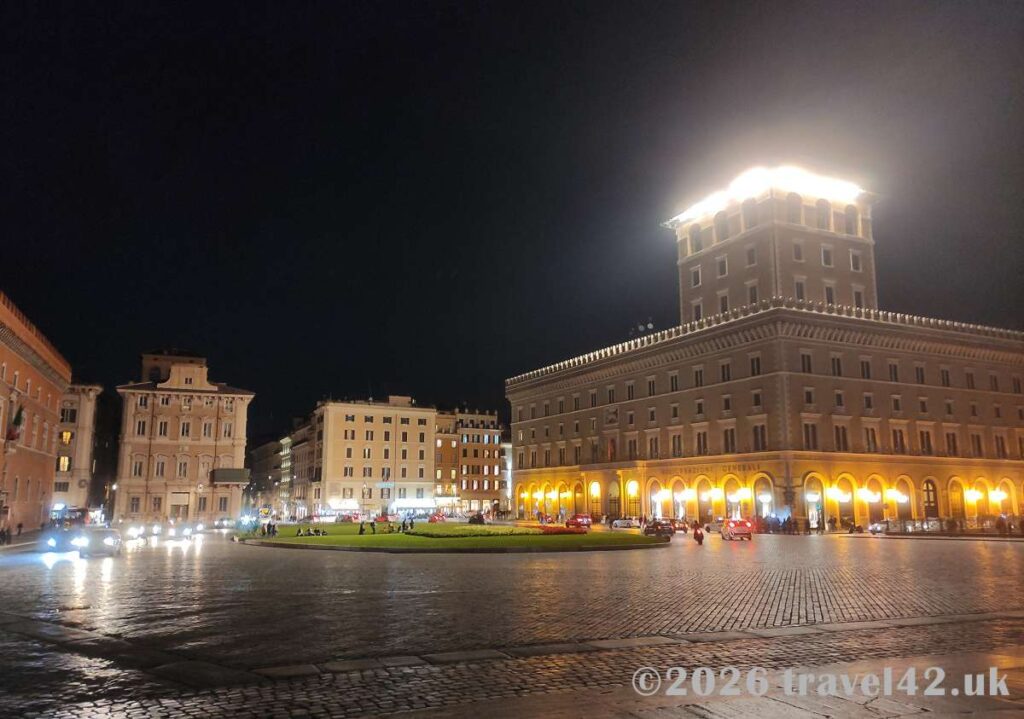 Piazza Venezia and Palazzo delle Assicurazioni Generali after dark