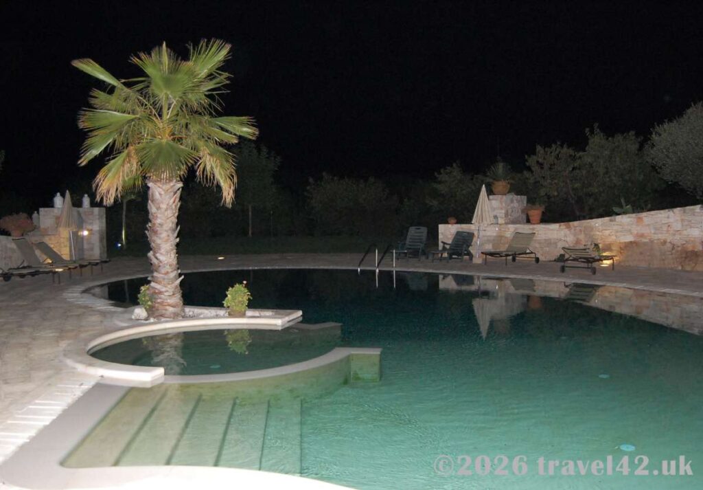 A peaceful evening beside the pool at a trulli retreat near Alberobello