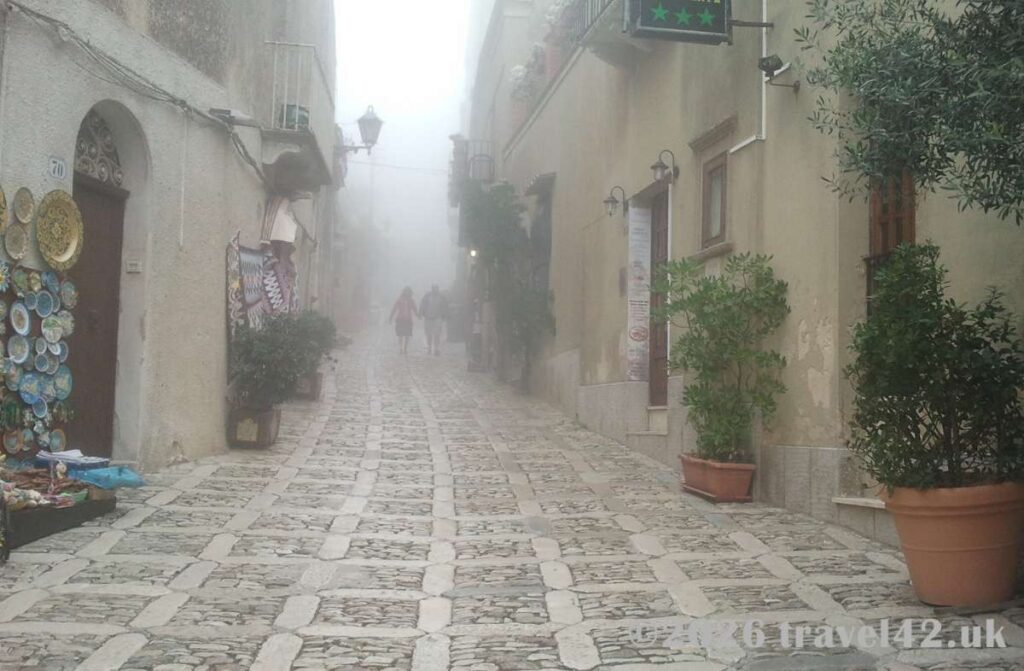 Wrapped in mist the ancient cobbled streets of Erice