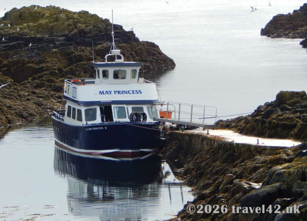 The May Princess arriving at the Isle of May